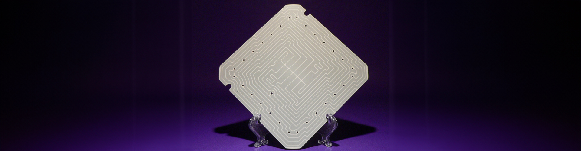 square metal plate with holes drilled out
